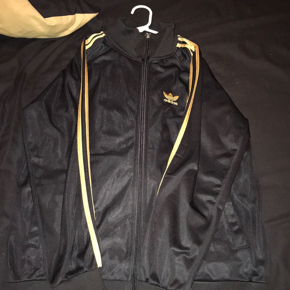 Black and gold adidas track suit